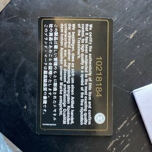 CHANEL Black and Gold Authentication Card